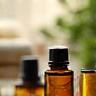 Image showing bottles of oil in a peaceful setting with soft light.